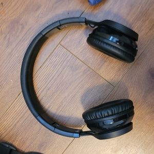 Black MPOW brand over ear wireless Bluetooth headset